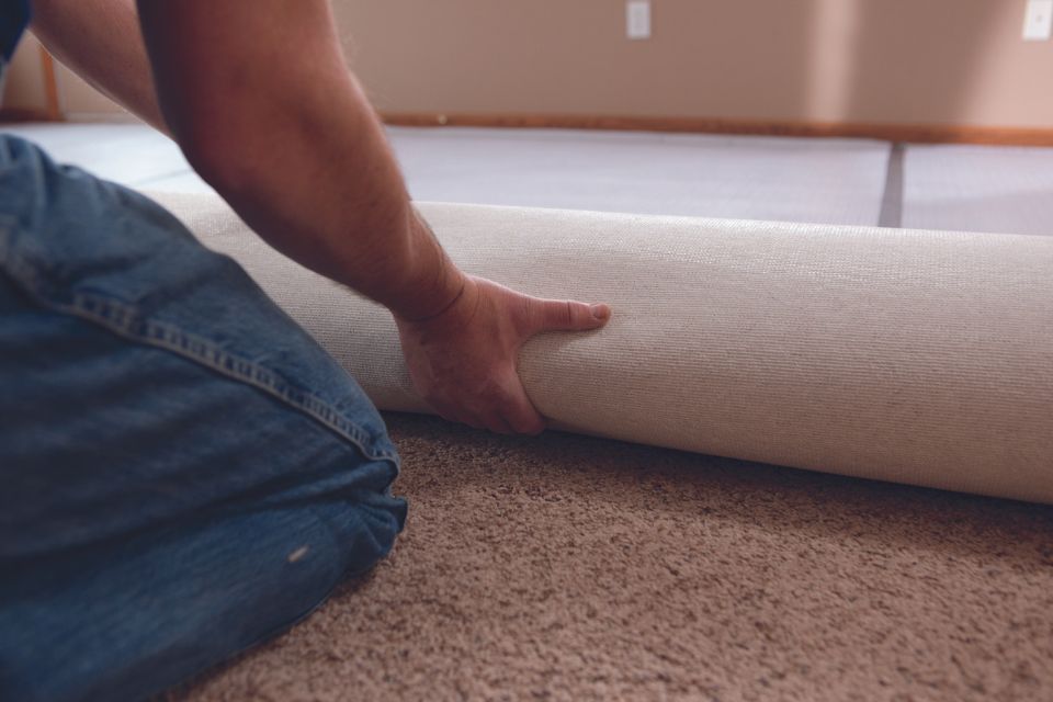 installing carpet courtesy of Carpet One
