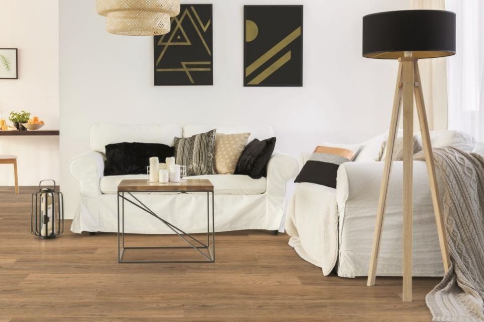Invincible H2O luxury vinyl flooring in living room with beige couch 