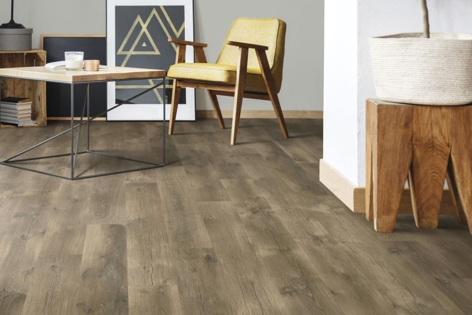 Dark laminate wood look flooring in living room with character 