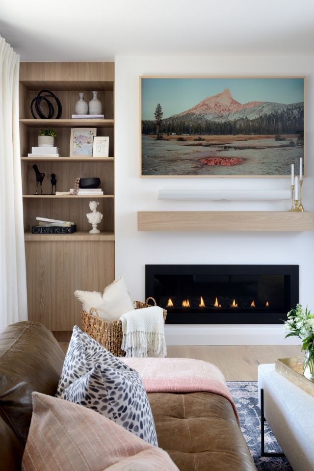 Warm living room design with fireplace by Michelle Berwick