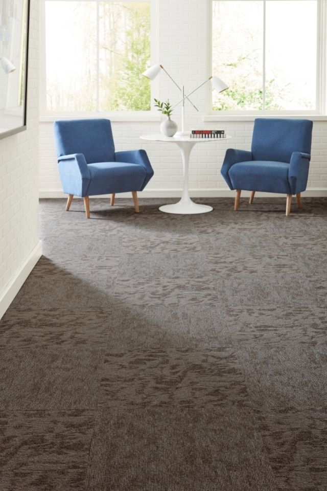 Patterned carpet tiles in commercial building by core elements 