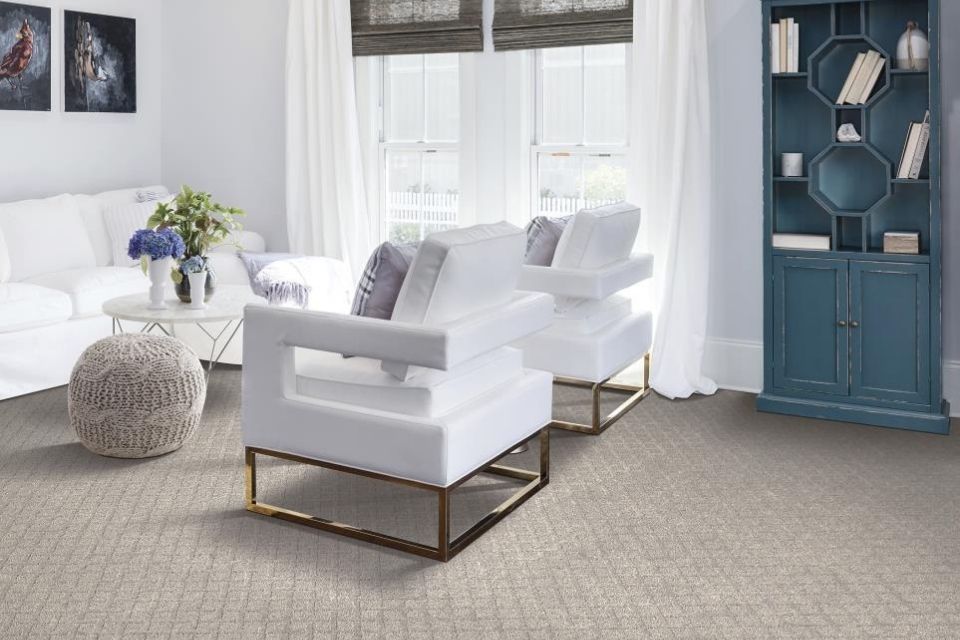 Patterned carpet trending for 2022 in living room with white furniture