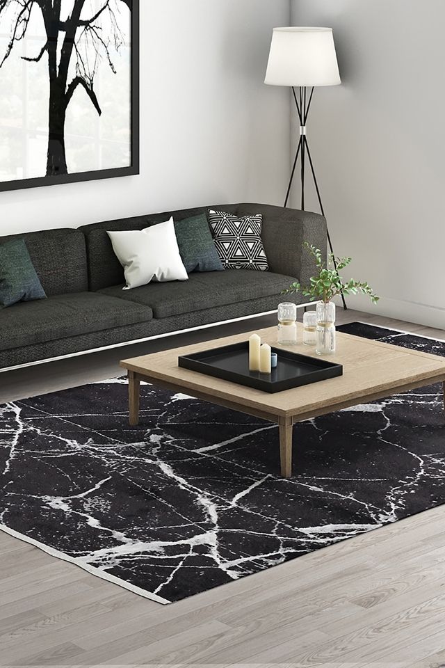 Black and white area rug for a pop of color in modern living room 