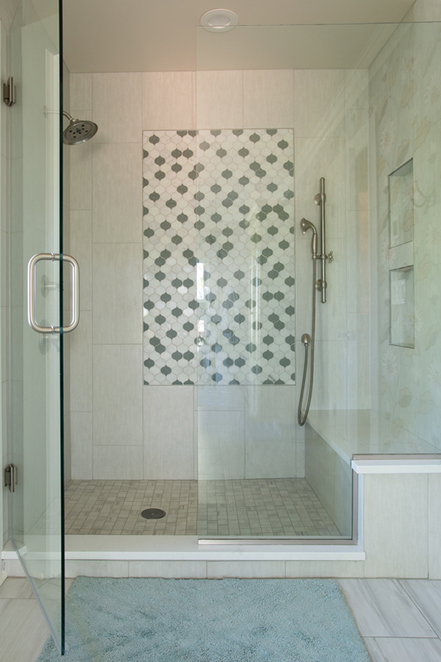Walk in shower with accent tile in center of shower wall 