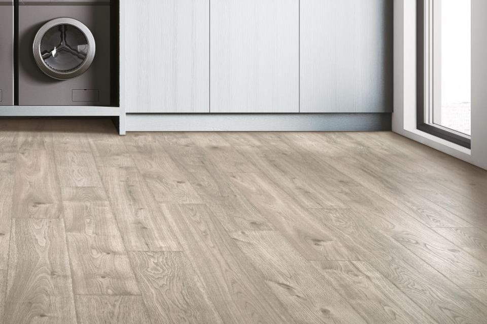 Mirror Lake Performance laminate flooring in laundry room in a light wood look 