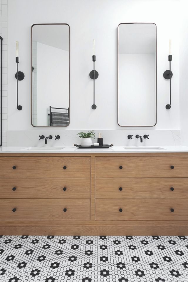 Modern black and white bathroom with oak vanity and long mirrors 