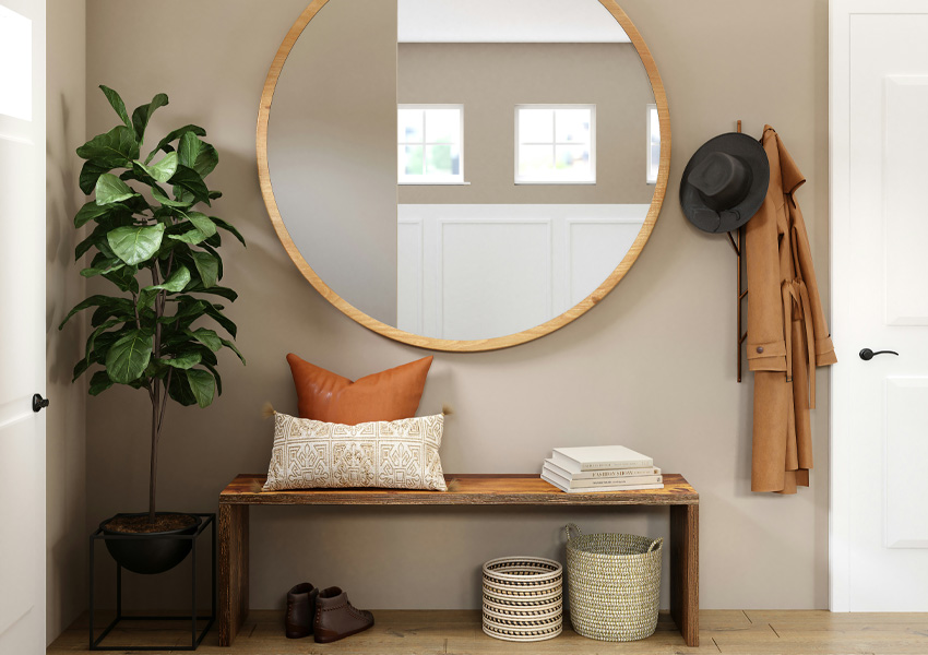 wood flooring in entryway with bench and bohemian decor
